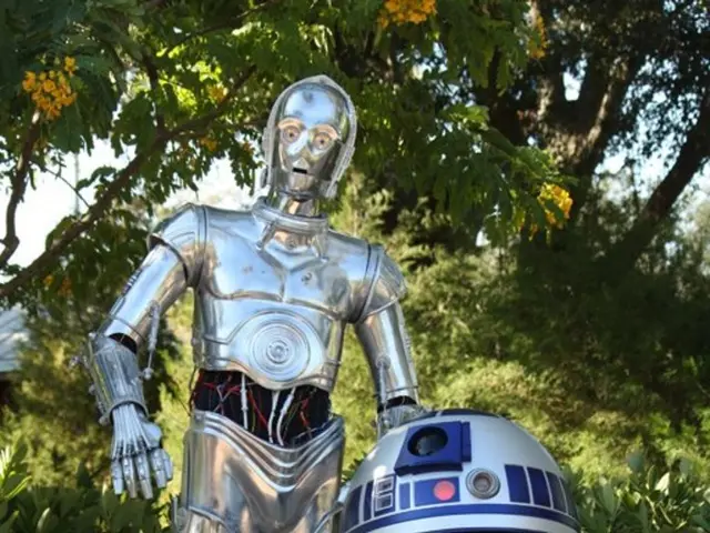 This is a robot near to it we can see an android robot machine. Behind to the robot we can see a...